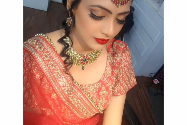 A bride having her makeup applied before the ceremony
